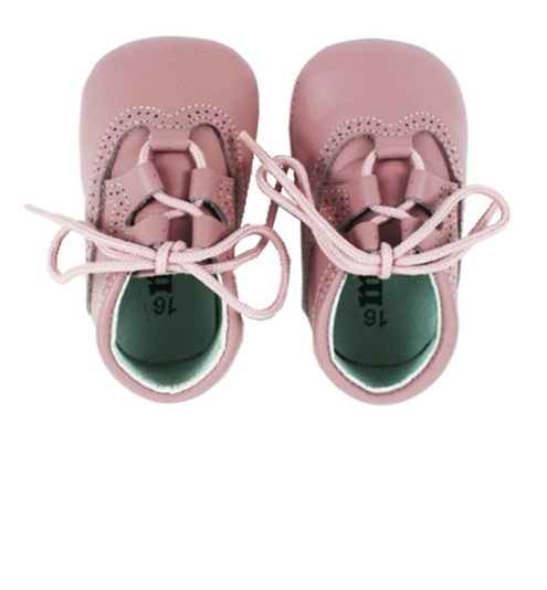 Baby shoes in pastel pink