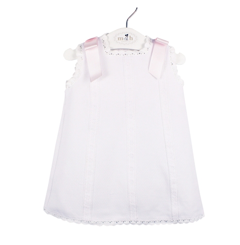 Short Baby’s Dress in white piqué fabric and pink bows. 